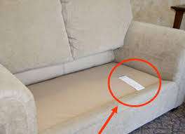 Sleeper sofa cleaning tag exposed.