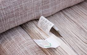 Close up of a cleaning tag on the underside of couch pillows.